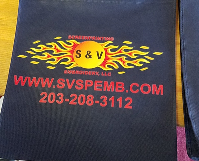 S & V logo printed on a navy bag